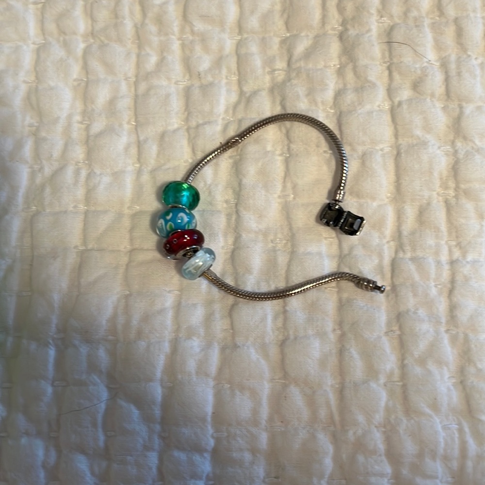 Assorted Chamilia beads and charm bracelet